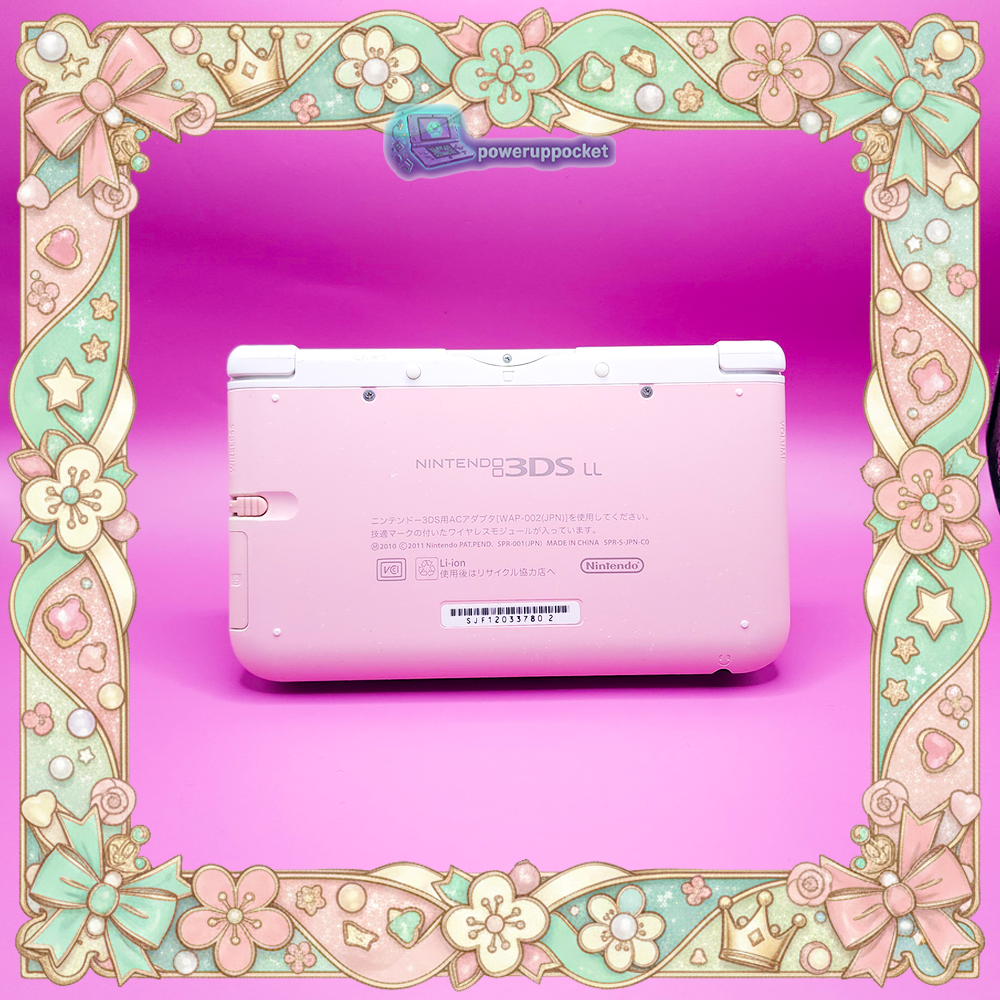 Bottom edge view of a custom Nintendo 3DS XL showing ports, cartridge slot, and pink and white shell details.