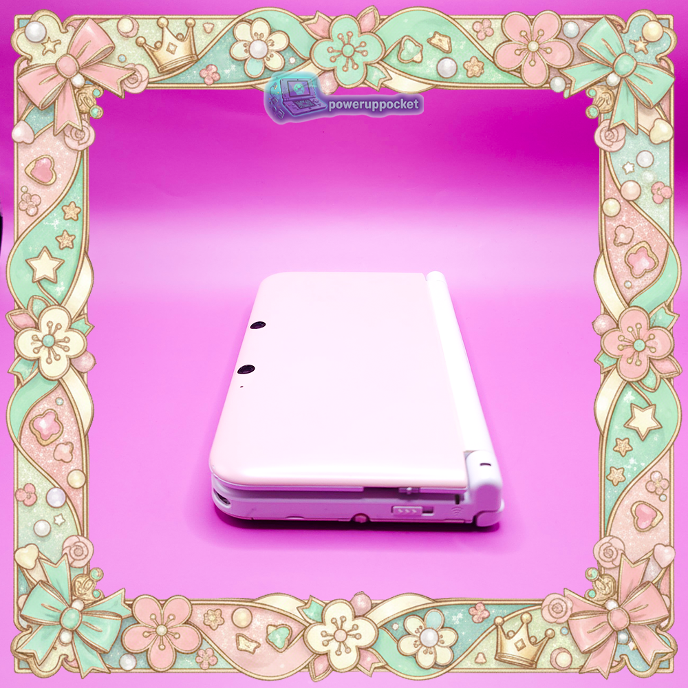 Right side view of a custom Nintendo 3DS XL with pink shell and white hinge, showing the system profile and ports.