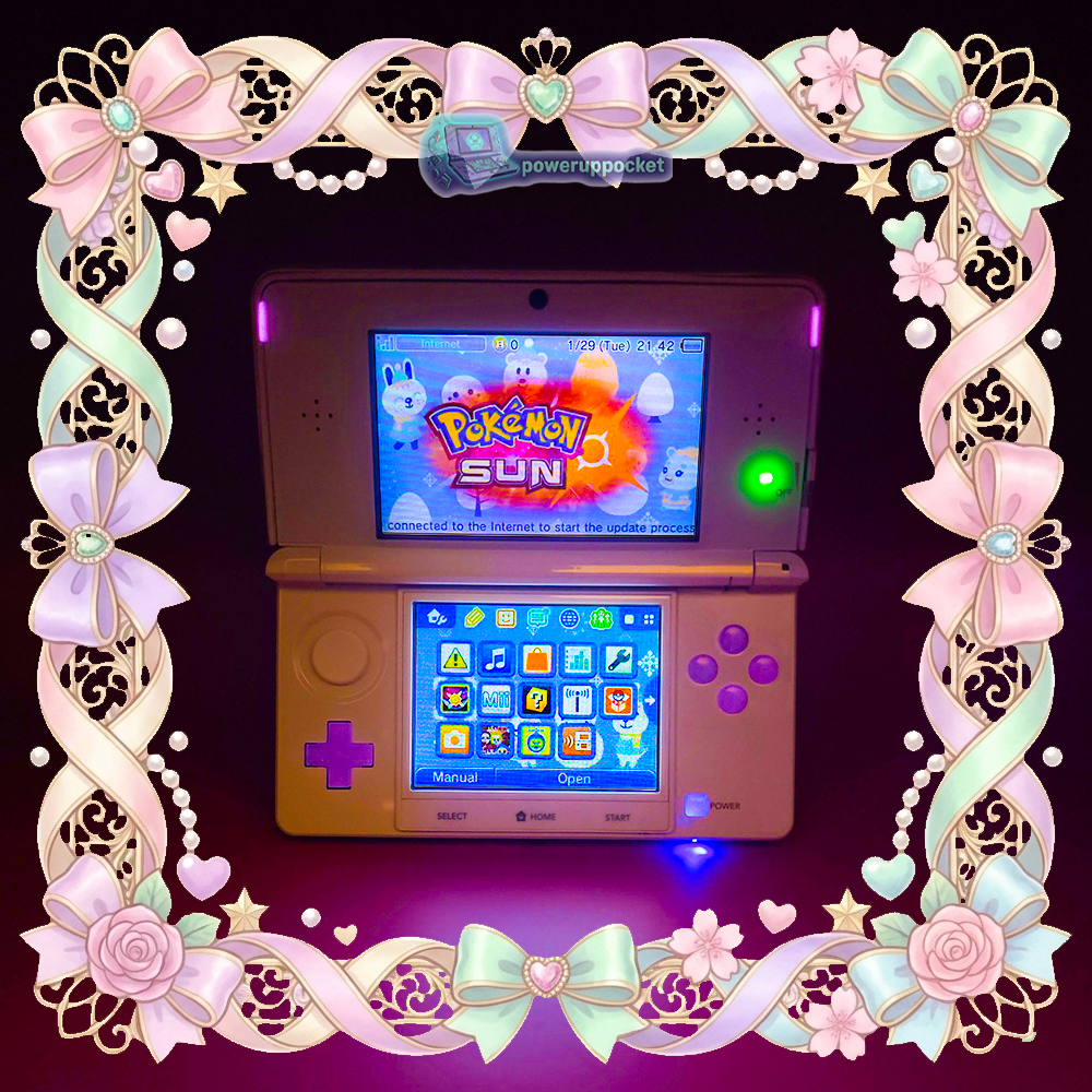 White Nintendo 3DS open in low light showing glowing buttons, custom glow buttons build by PowerUpPocket.